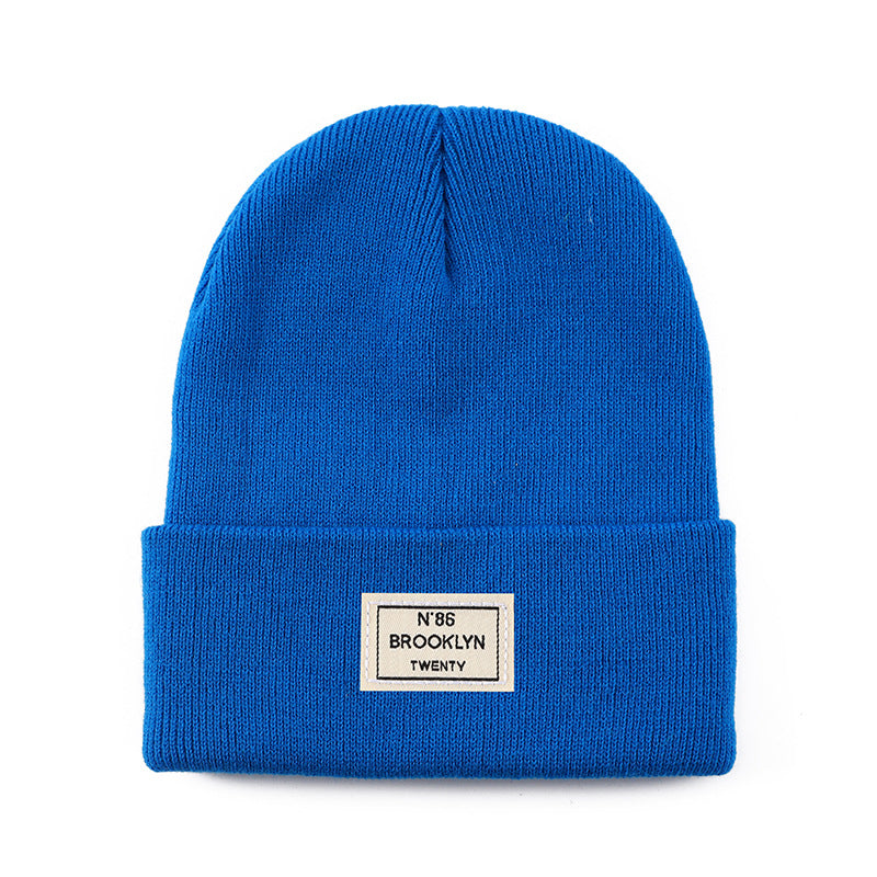 Knitted Beanie With Brand Label Stylish And Fashionable