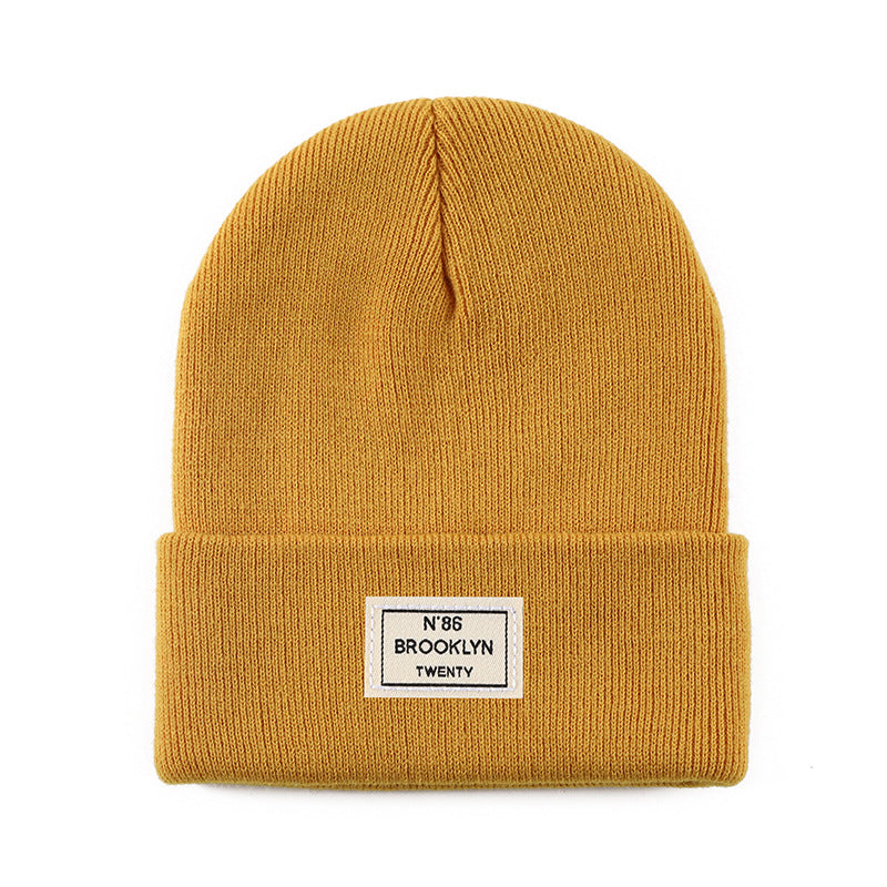 Knitted Beanie With Brand Label Stylish And Fashionable