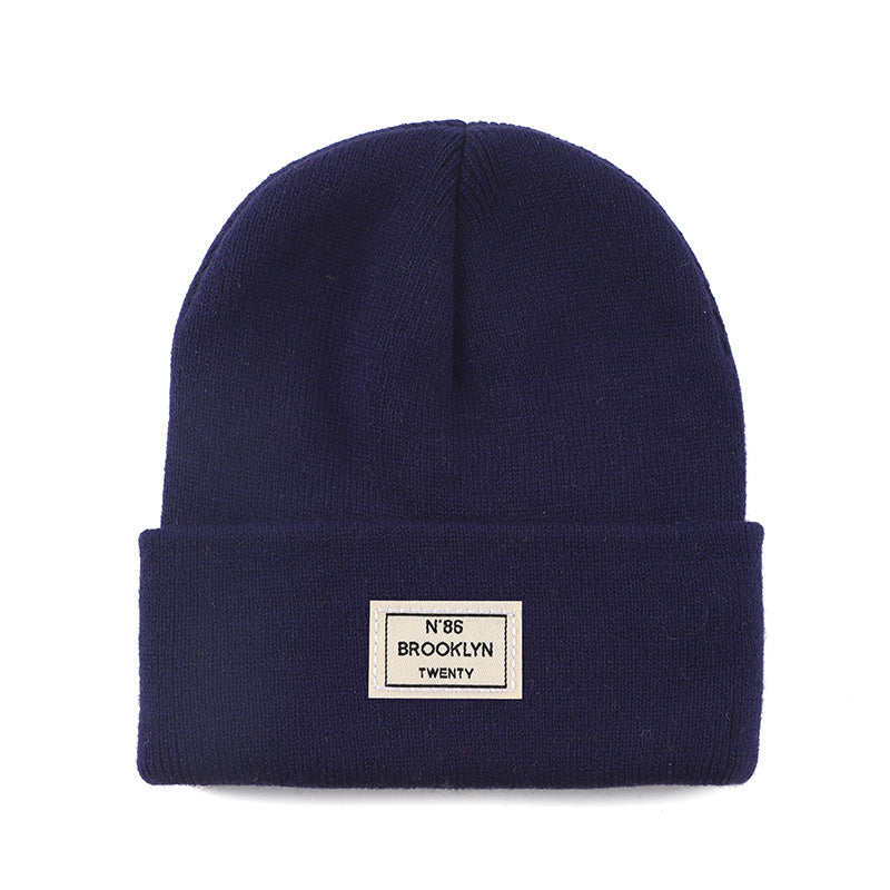 Knitted Beanie With Brand Label Stylish And Fashionable