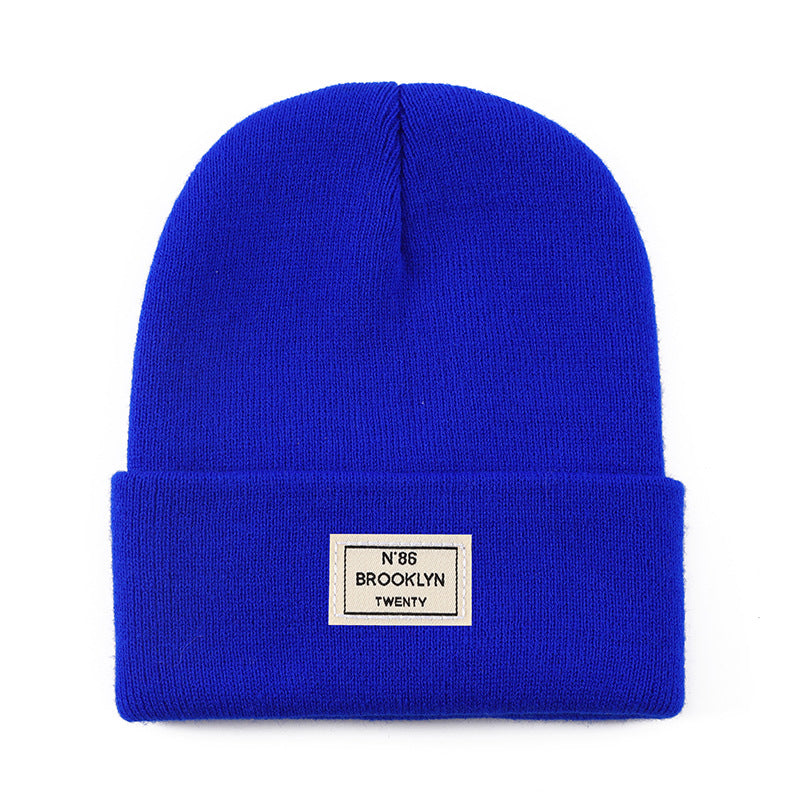 Knitted Beanie With Brand Label Stylish And Fashionable