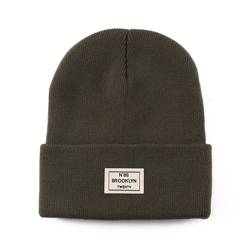 Knitted Beanie With Brand Label Stylish And Fashionable