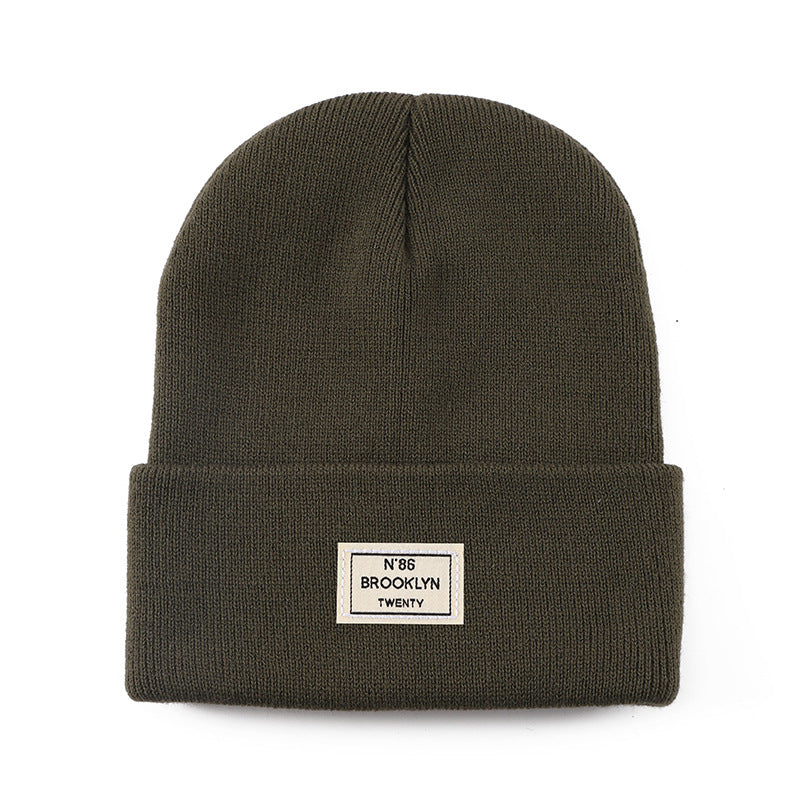 Knitted Beanie With Brand Label Stylish And Fashionable