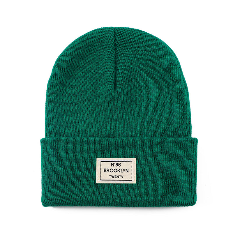 Knitted Beanie With Brand Label Stylish And Fashionable